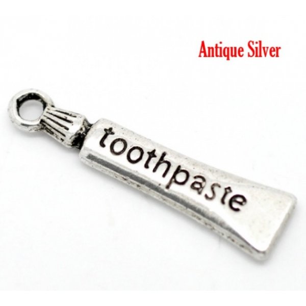 Charm tubo dentifricio argento