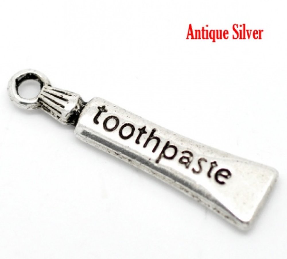 Charm tubo dentifricio argento