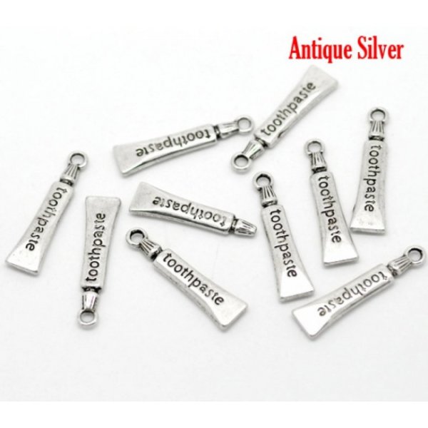 Charm tubo dentifricio argento