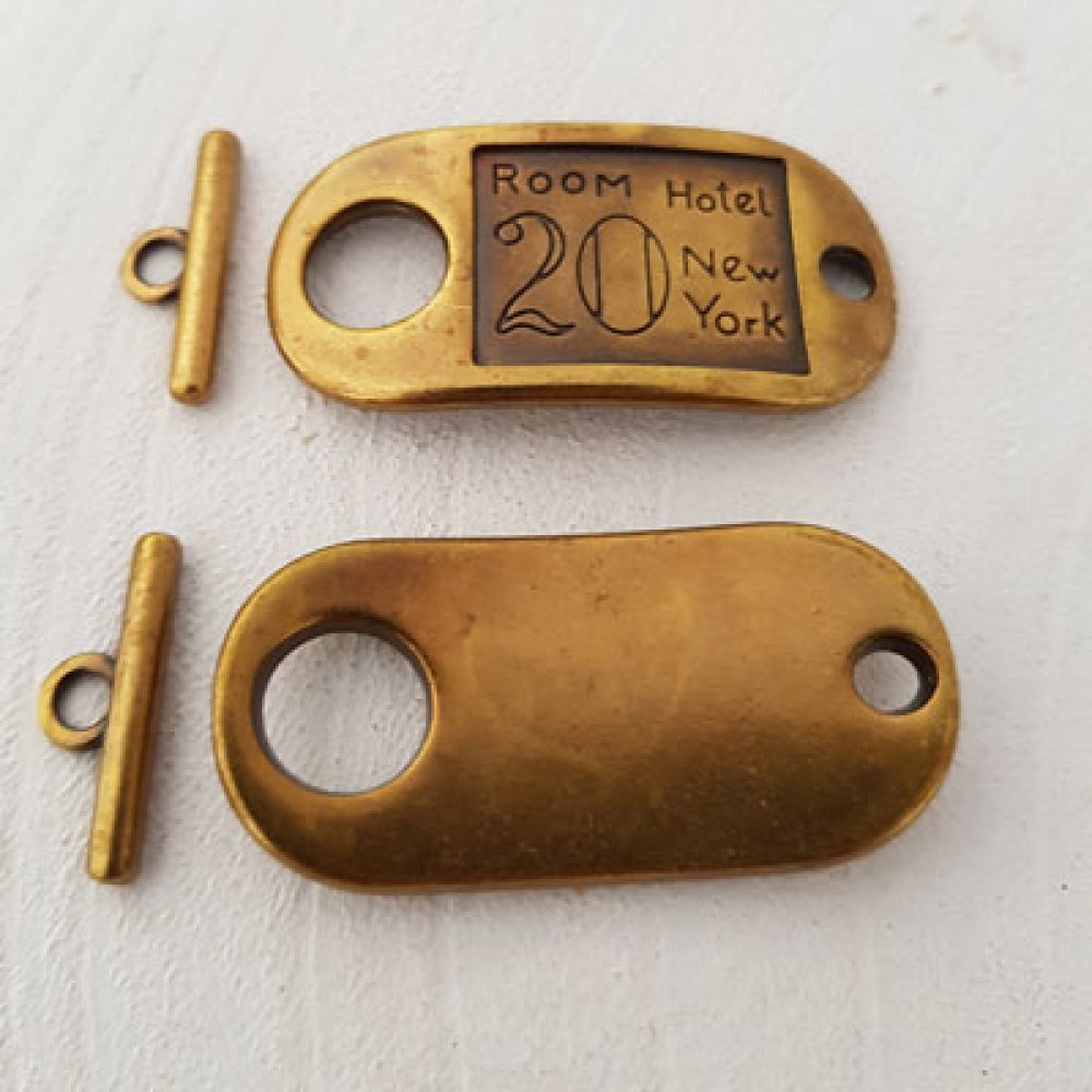 Fermagli Motivo Camera Hotel Bronzo N°15
