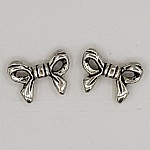 Charm Node N°11 - Fascino con nodo a nastro in metallo argentato