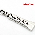 Charm tubo dentifricio argento