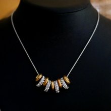 Collana con anelli in argento e oro