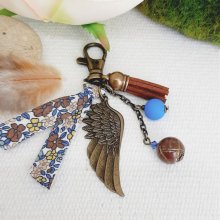 Portachiavi o borsa gioiello con ciondolo a forma di ala d'angelo color bronzo e blu 