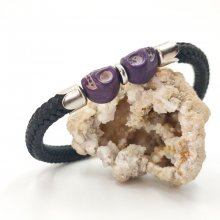 Bracciale con doppio teschio e ossa incrociate con pietre viola su corda nera