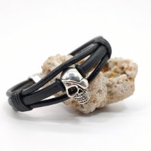 Bracciale con teschio e ossa incrociate su cordoncini di pelle nera