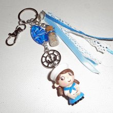 Gioielli per portachiavi/borsa perline di vetro blu e piccolo marinaio con nastri 