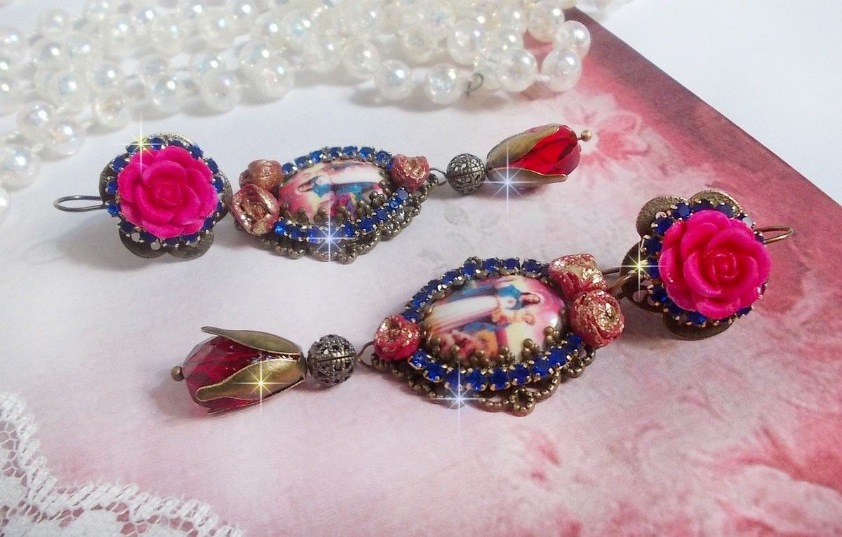 BO Maria e Gesù creati con cabochon di resina, pere rosse sfaccettate e vari accessori