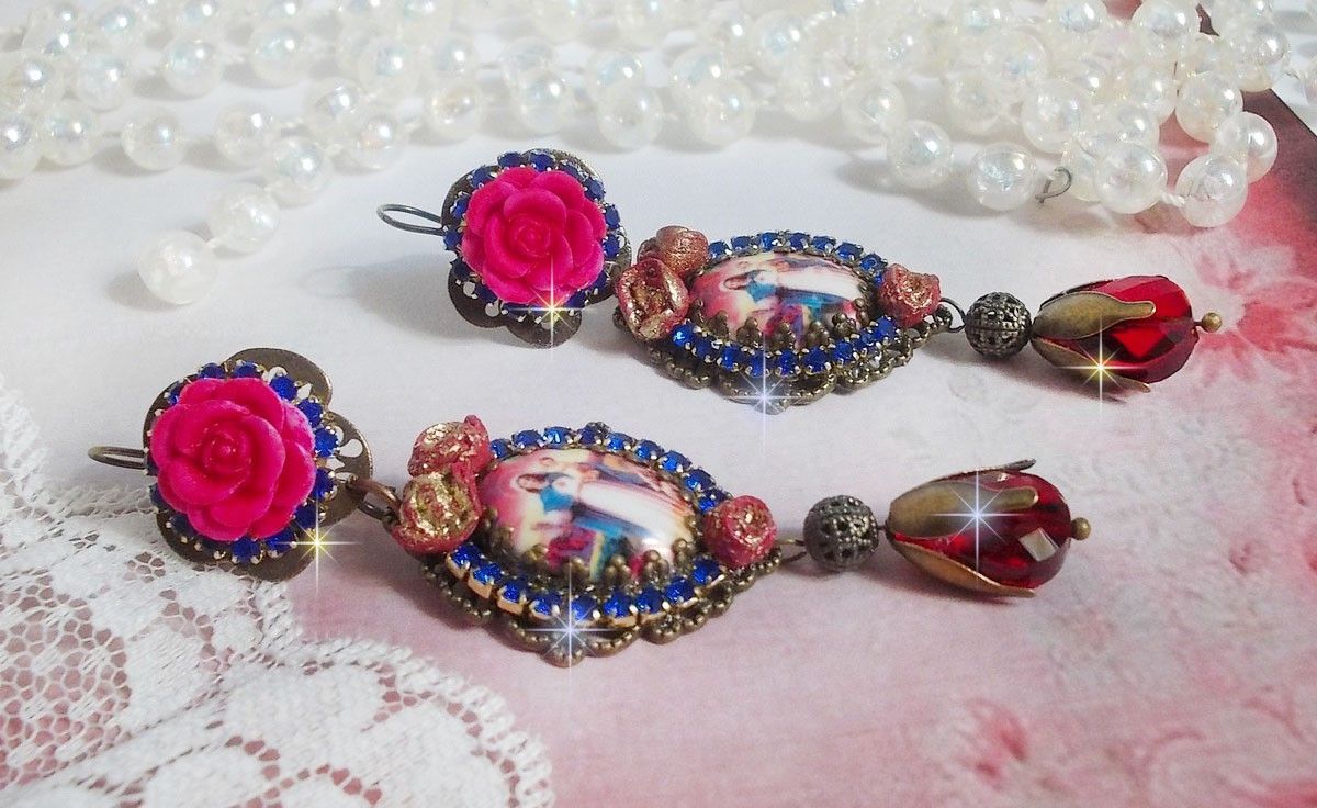 BO Maria e Gesù creati con cabochon di resina, pere rosse sfaccettate e vari accessori