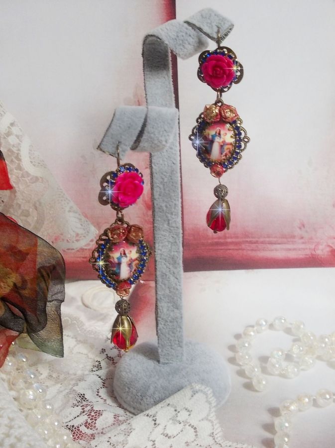 BO Maria e Gesù creati con cabochon di resina, pere rosse sfaccettate e vari accessori