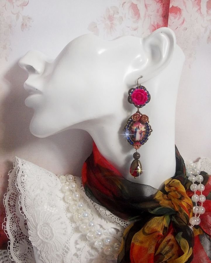 BO Maria e Gesù creati con cabochon di resina, pere rosse sfaccettate e vari accessori