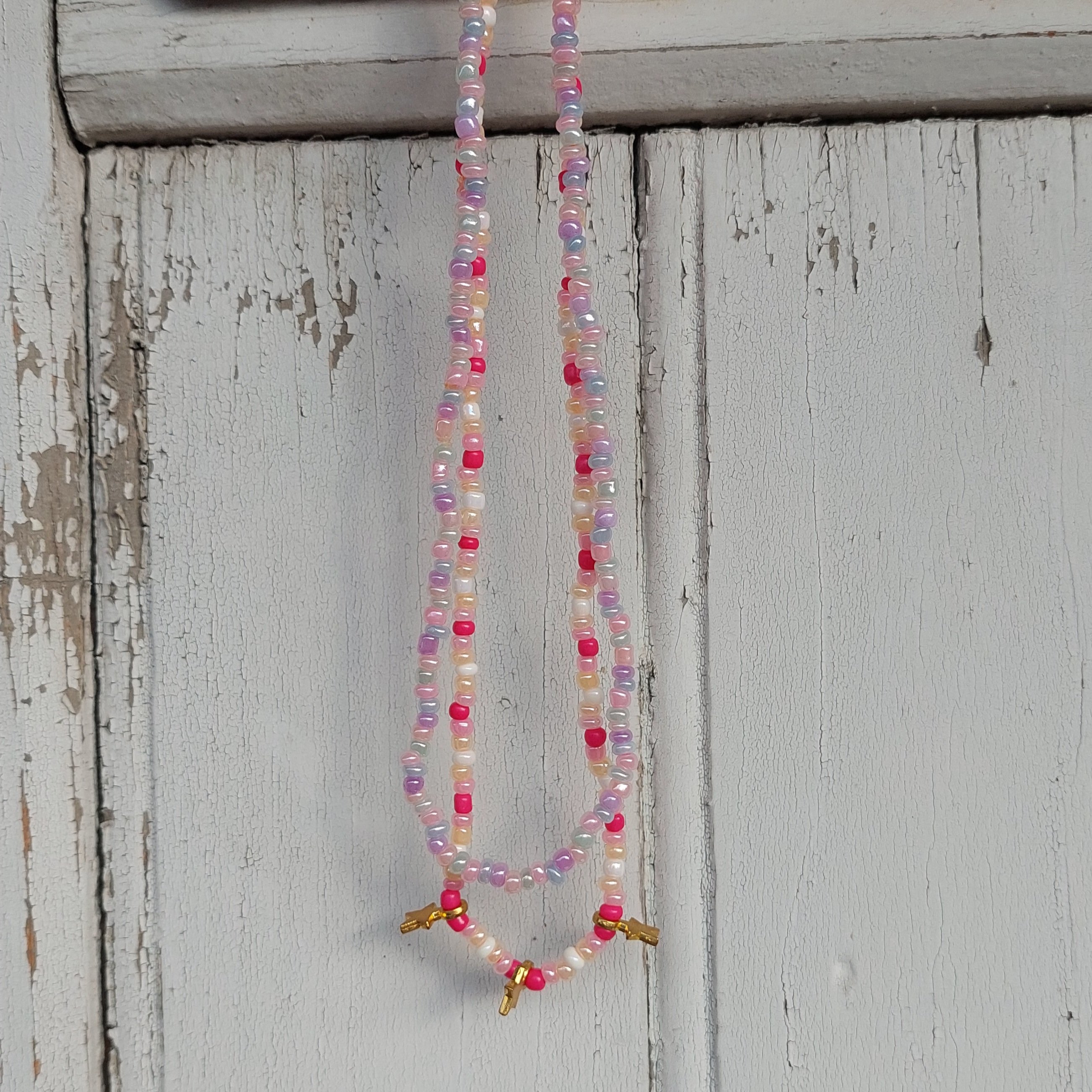 Ras du cou flaschi rose et &eacute;toiles dor&eacute;es