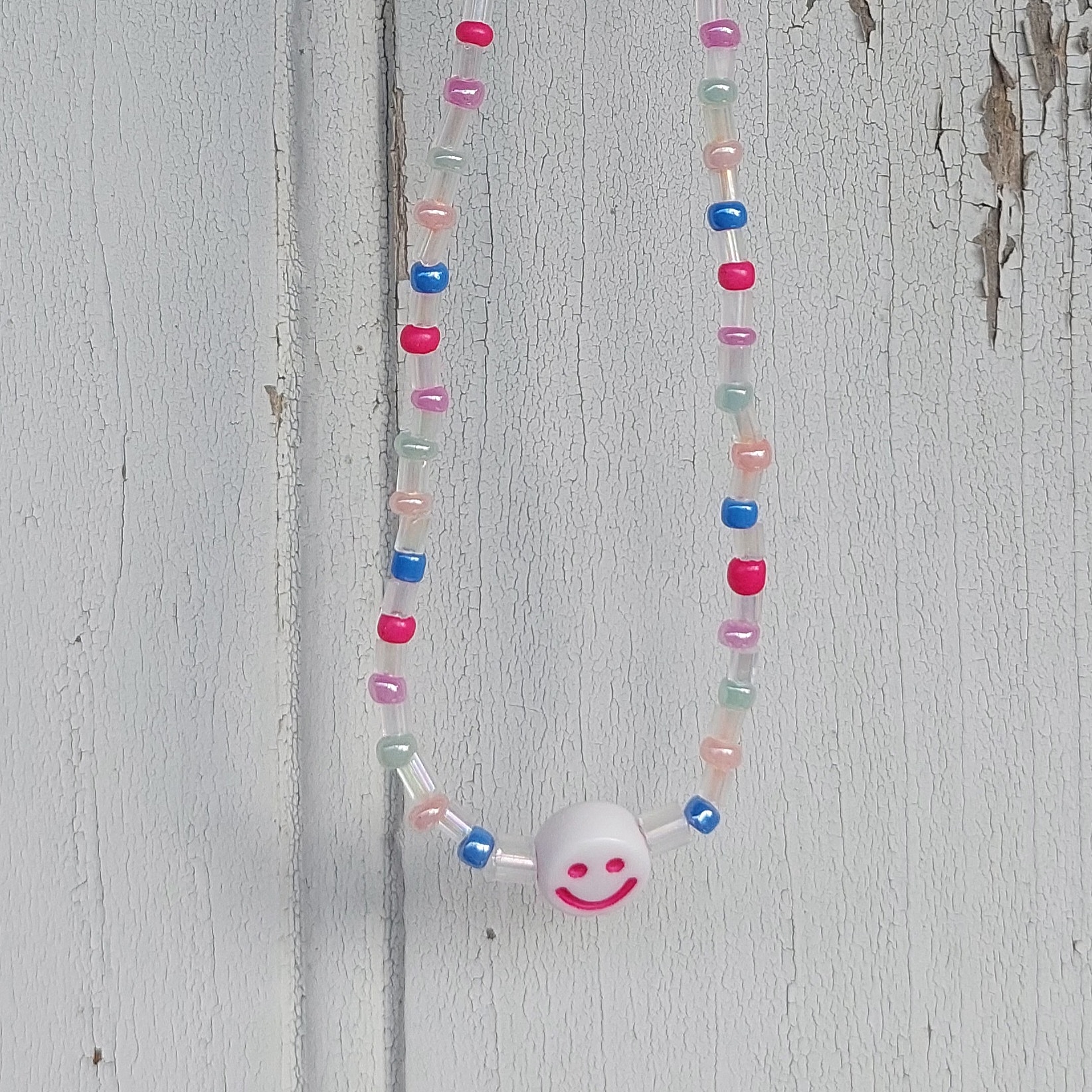 Ras du cou Smiley couleur pastel